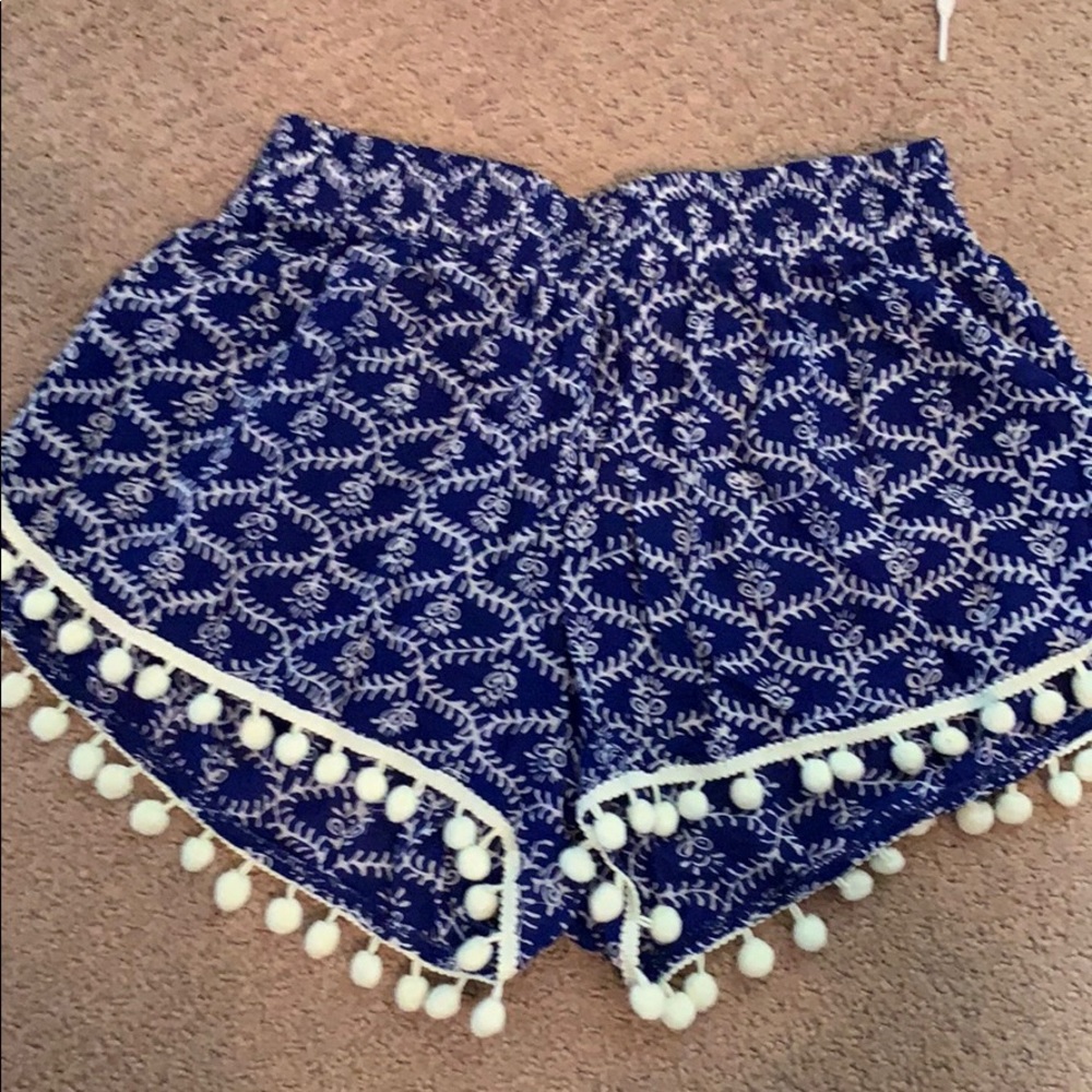 Pattern shorts with Pom poms